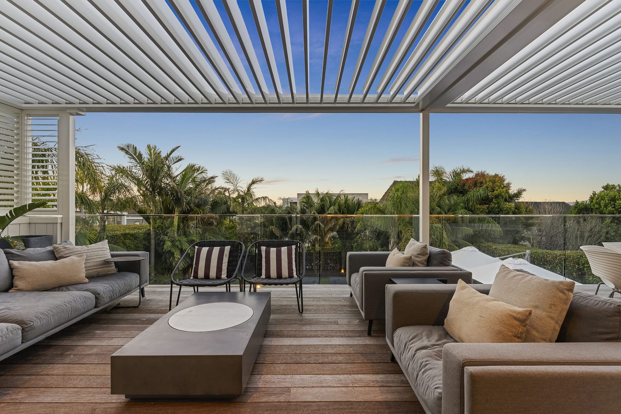 Modern patio with an adjustable louvre roof, providing shade, weather protection, and stylish outdoor living.