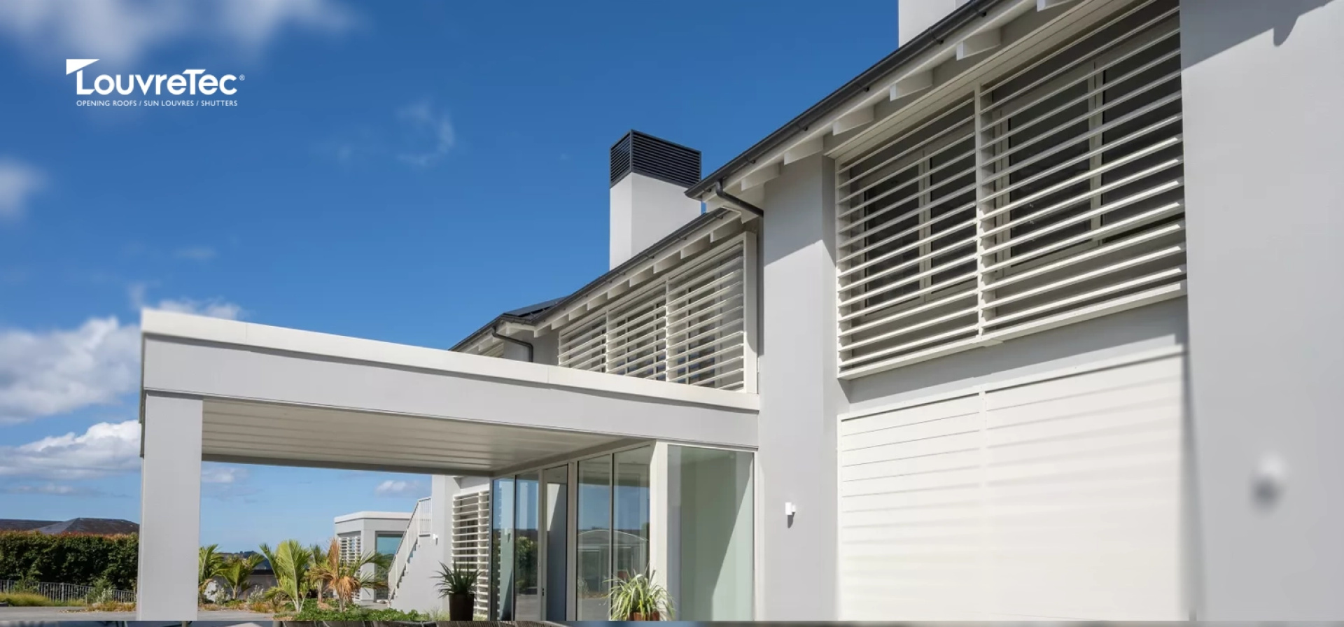 Louvretec rectangular sun louvres used as horizontal privacy screens and facade panels on a contemporary Australian home.