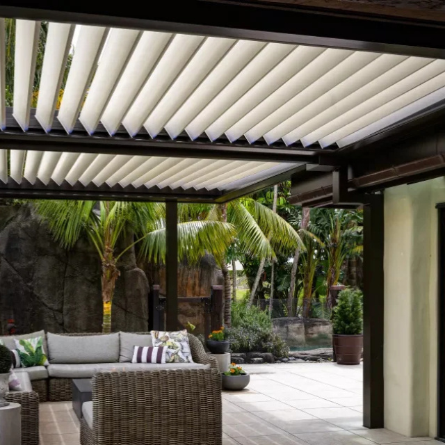 Modern residential patio with a Louvretec opening roof and comfortable outdoor furniture.