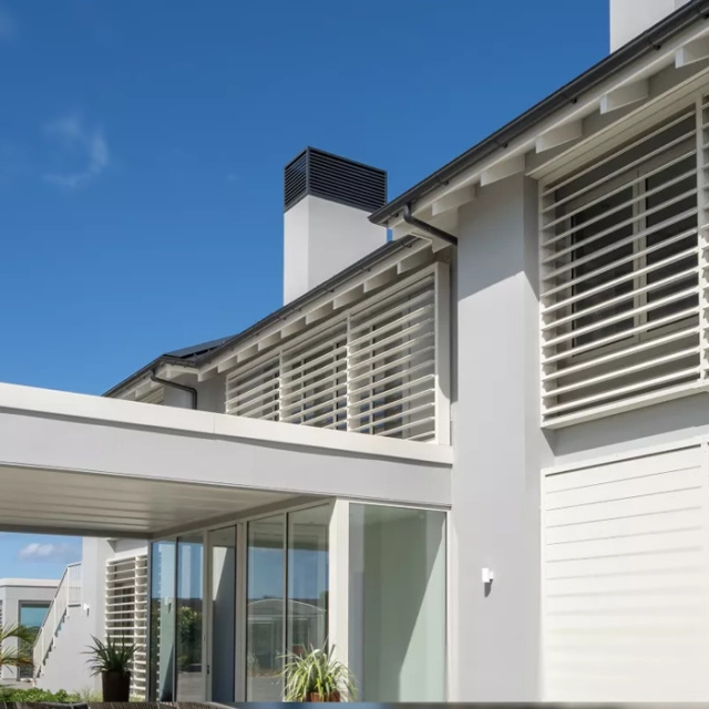 Louvretec rectangular sun louvres used as horizontal privacy screens and facade panels on a contemporary Australian home.