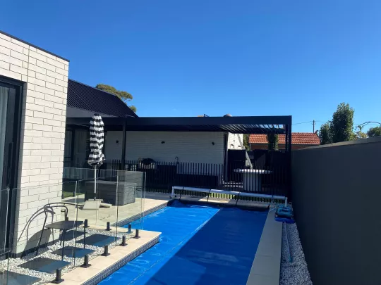 Opening Roof creating poolside comfort. By Louvretec Tasmania